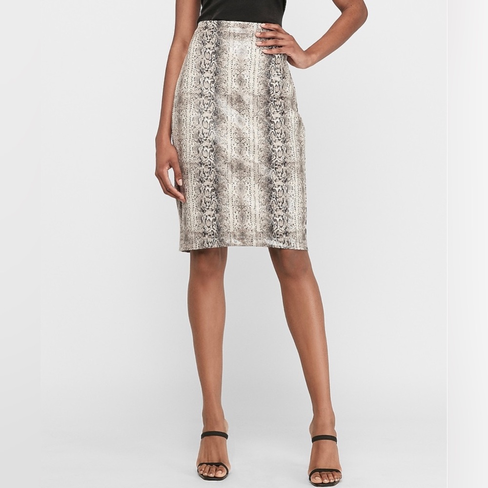 NWT- High waisted, elastic band, center back vent, snakeskin skirt.